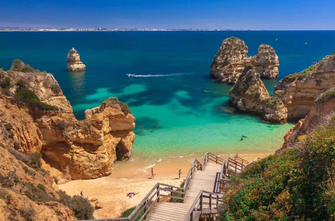 Golden cliffs and turquoise cove in southern Portugal